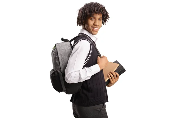 非洲裔美国学生 手里拿着书本 肩头朝外看 背景是白色的 — 图库照片