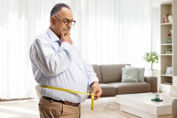 Worried Mature Man Measuring His Waist Living Room Home — Stock Photo, Image
