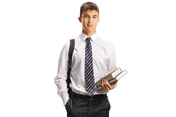 Masculino Teen Estudante Escola Uniforme Segurando Livros Isolado Branco Fundo — Fotografia de Stock