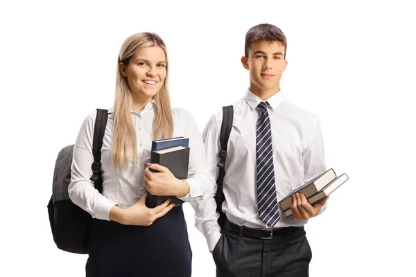 Mannelijke Vrouwelijke Studenten Een Uniform Met Boeken Geïsoleerd Witte Achtergrond — Stockfoto
