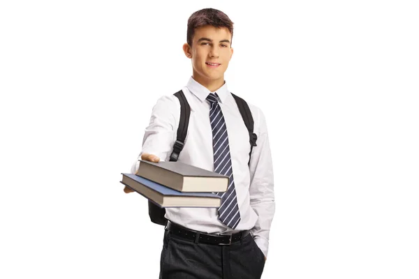 Homme Adolescent Dans Uniforme Scolaire Donnant Des Livres Isolés Sur — Photo