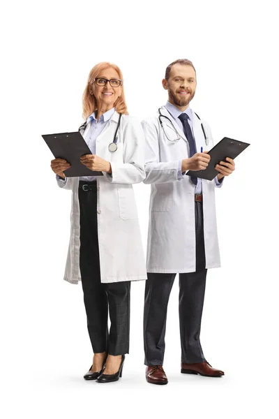 Male Female Doctors Standing Holding Clipboards Isolated White Background — Stock Photo, Image