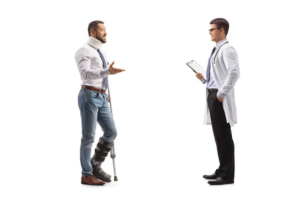 Injured Male Patient Orthopedic Boot Cervical Collar Talking Male Physician — Stock Photo, Image