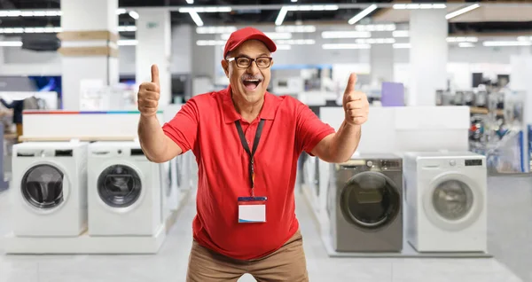 Excited Mature Salesman Gesturing Thumbs Appliance Store — Stock Photo, Image