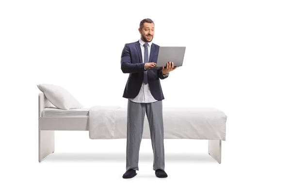 Man Wearing Suit Bottom Pajamas Holding Laptop Computer Front Bed — Stock Photo, Image