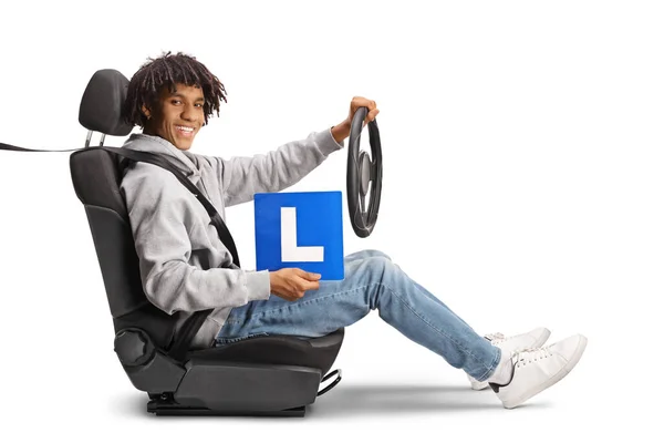 African American Young Man Holding Steering Wheel Learner Plate Isolated — Stock Photo, Image