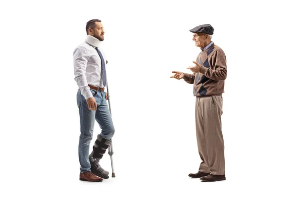 Full Length Profile Shot Senior Man Talking Injured Man Crutch — Stock Photo, Image