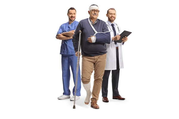 Male Doctors Mature Male Patient Leg Head Injury Isolated White — Stock Photo, Image