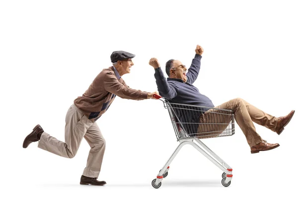 Uomo Anziano Spingendo Amico All Interno Carrello Isolato Sfondo Bianco — Foto Stock