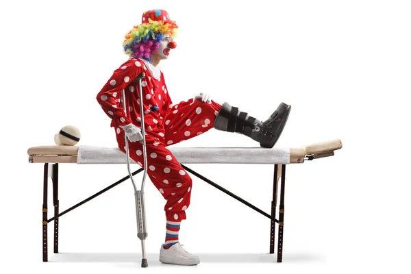 Injured Clown Walking Brace Sitting Therapy Bed Isolated White Background — Stock Photo, Image