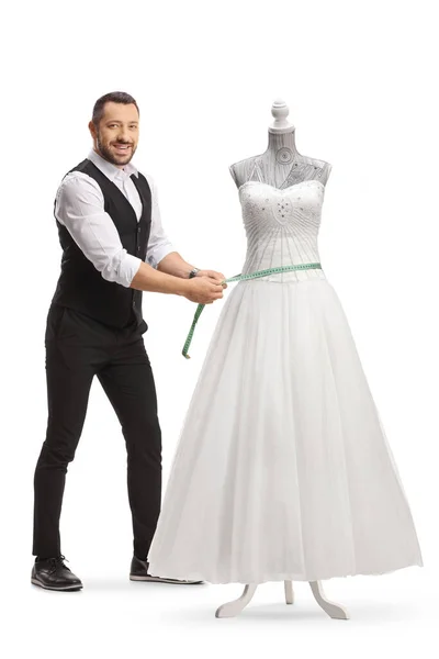 裁缝师在白色背景的人偶上量身定做婚纱 — 图库照片