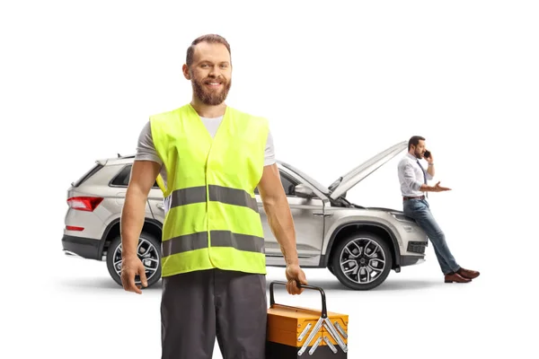 Road Assistance Worker Reflective Vest Standing Front Car Isolated White — Stock Photo, Image