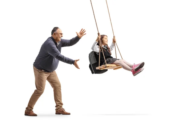 Mature Man Pushing Schoolgirl Swing Isolated White Background — Stock Photo, Image