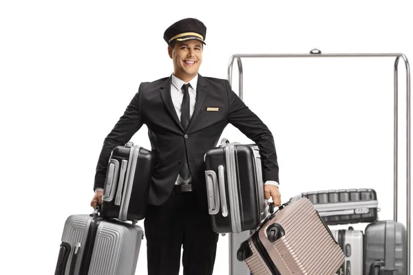 Bellboy Holding Many Suitcases Standing Front Luggage Cart Isolated White — Stock Photo, Image