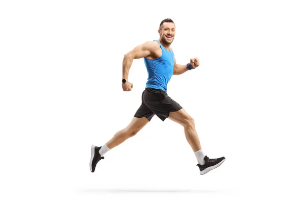 一名男子穿着运动服跑步 面带微笑 在白色背景下被隔离的全景照片 — 图库照片