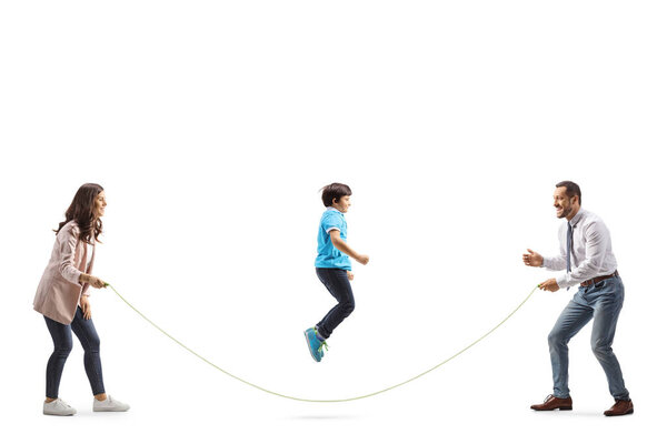 Mother and father playing skipping rope with son isolated on white background
