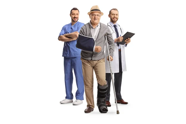 Full Length Portrait Senior Male Patient Crutch Doctors Standing Back — Stock Photo, Image