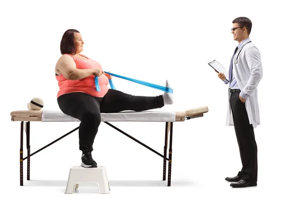 Overweight Woman Exercising Stretching Band Doctor Standing Isolated White Background — Stock Photo, Image