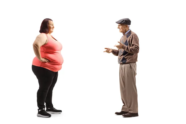 Full Length Profile Shot Senior Man Talking Overweight Young Woman — Zdjęcie stockowe