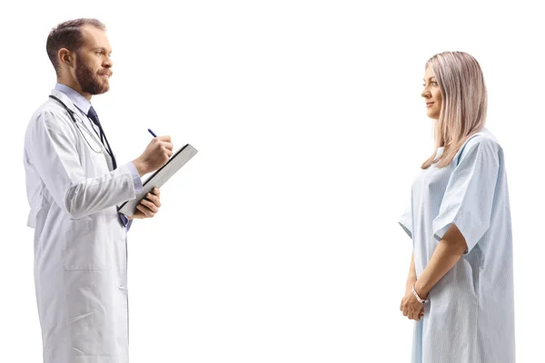 Male Doctor Writing Document Talking Hospitalized Female Isolated White Background — Stock Photo, Image