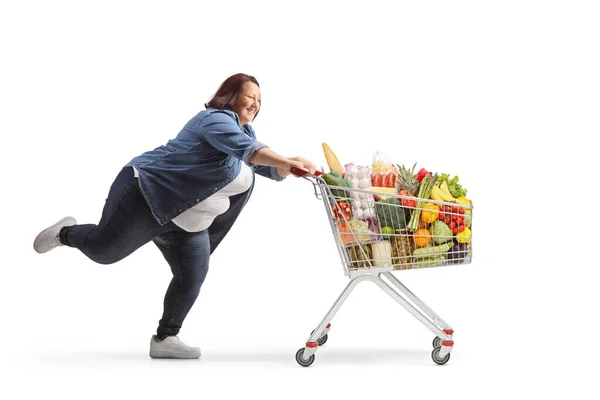 Full Length Profile Shot Corpulent Young Woman Running Shopping Cart — Zdjęcie stockowe