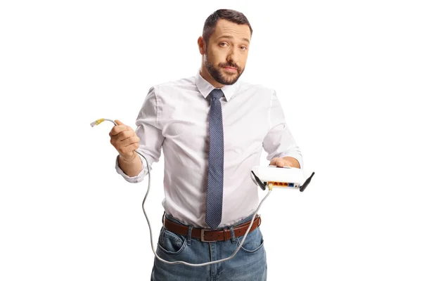 Gelangweilte Junge Mann Mit Einem Router Isoliert Auf Weißem Hintergrund — Stockfoto