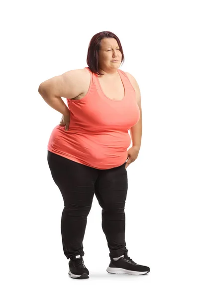 白い背景に隔絶された腰痛を抱える太りすぎの若い女性 — ストック写真