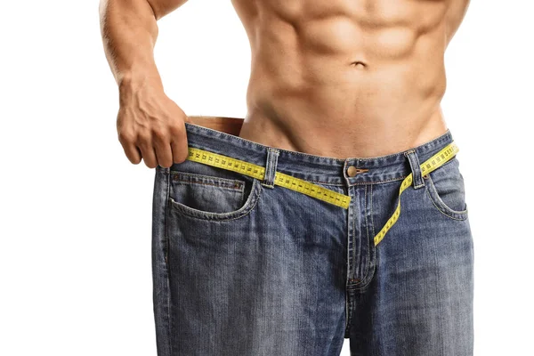 Gewichtsverlies Concept Fit Man Met Buikspieren Een Grote Jeans Geïsoleerd — Stockfoto
