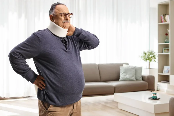 Mature Man Pain Wearing Cervical Collar Holding His Neck Home — Stock Photo, Image