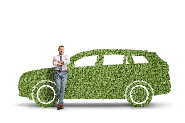 Full Length Portrait Man Leaning Green Car Made Grass Isolated — Stock Photo, Image