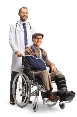Full length shot of a doctor and an injured mature patient in a wheelchair isolated on white background 