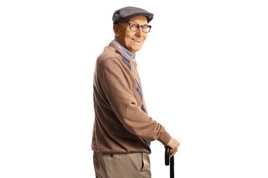 Happy senior man with a cane looking over shoulder isolated on white background
