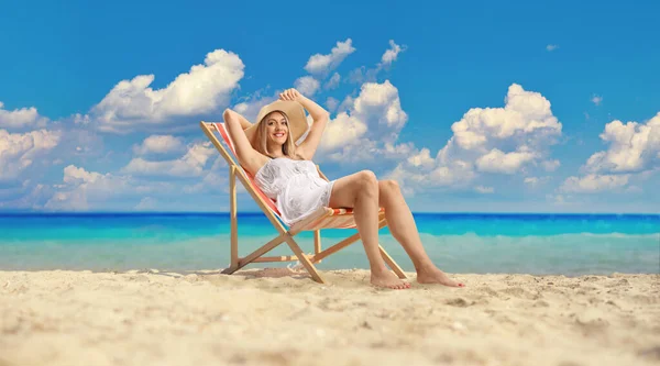 Happy Young Woman White Dress Straw Hat Sitting Beach Chair — Stok fotoğraf