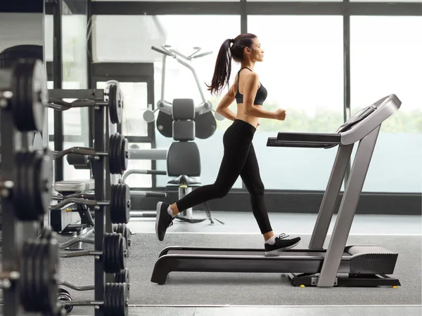 Full Length Profile Shot Young Woman Running Treadmill Gym — Stock Photo, Image