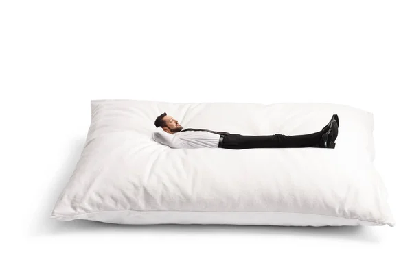 Επιχειρηματίας Ξαπλωμένος Ένα Μεγάλο Μαξιλάρι Απομονωμένος Λευκό Φόντο — Φωτογραφία Αρχείου