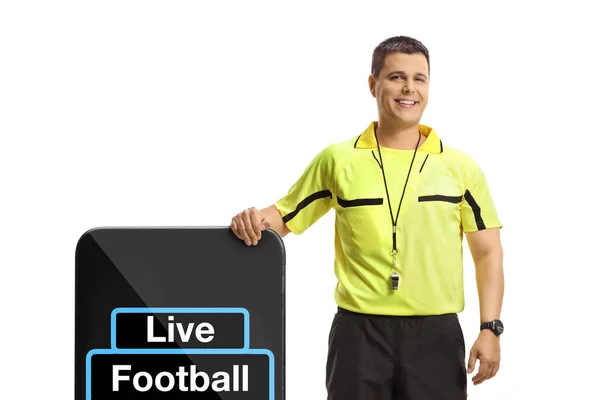 站在一个装有文字直播足球的大型智能手机旁边 背景是白色的 — 图库照片