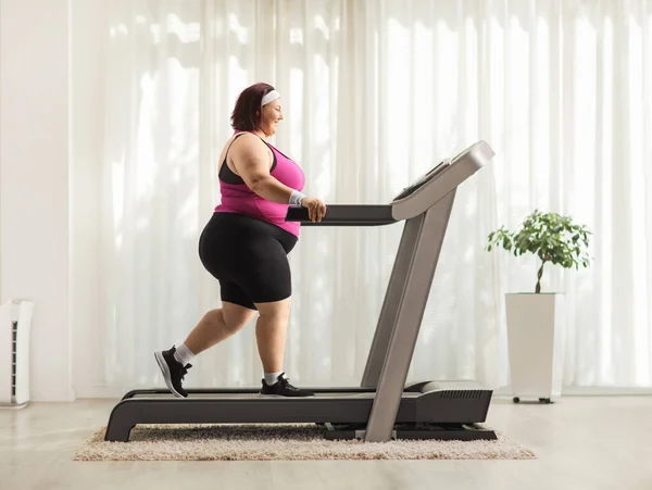 Overweight Woman Walking Treadmill Home — Stock Photo, Image
