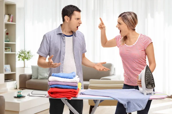 Young Couple Arguing Ironing Board Home Living Room — Stock Photo, Image