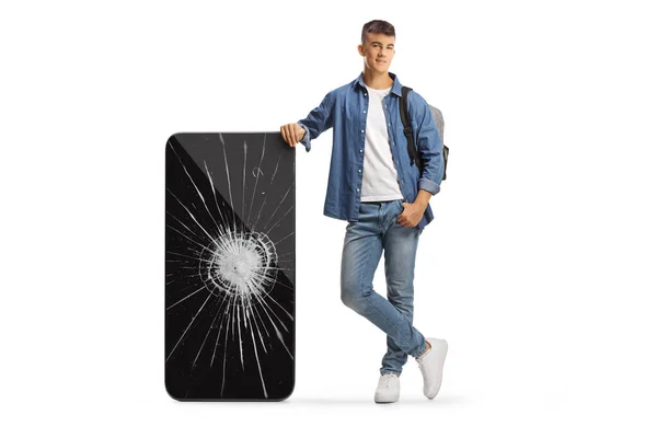 Man Student Met Een Rugzak Leunen Een Grote Mobiele Telefoon — Stockfoto