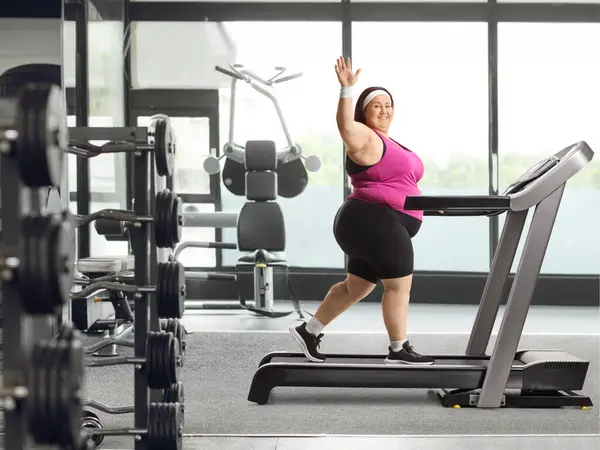 Smiling Young Corpulent Woman Walking Treadmill Gym Waving Camera — Stock Photo, Image