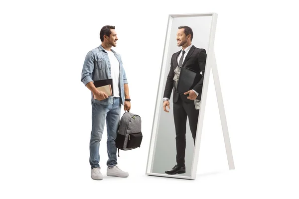 Student with books looking at a businessman with briefcase of money in a mirror isolated on white background