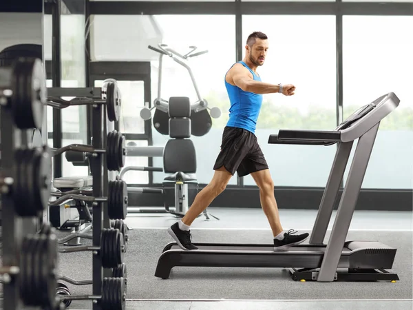 Full Length Shot Guy Exercising Treadmill Looking His Smartwatch Gym — Stock Photo, Image