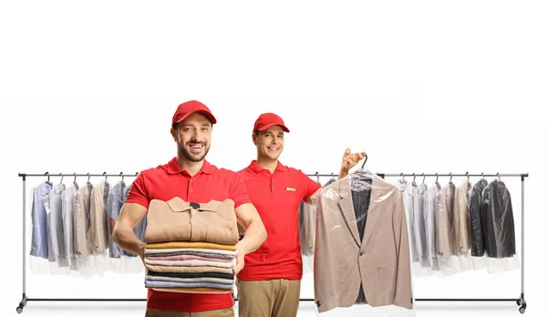 Workers Holding Clean Clothes Dry Cleaners Front Clothing Racks Isolated — Stock Photo, Image