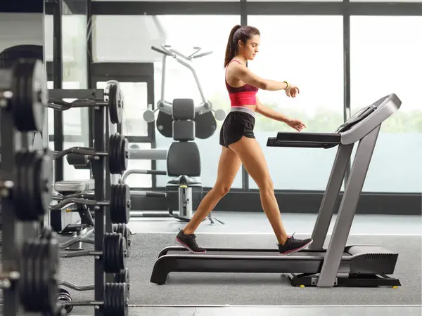 Full Length Profile Shot Fit Young Woman Exercising Treadmill Checking — Stock Photo, Image