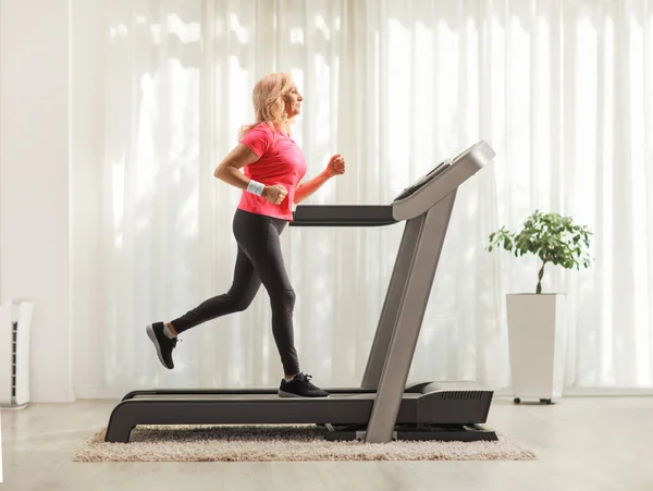 Full Length Profile Shot Mature Woman Running Treadmill Home — Stock Photo, Image