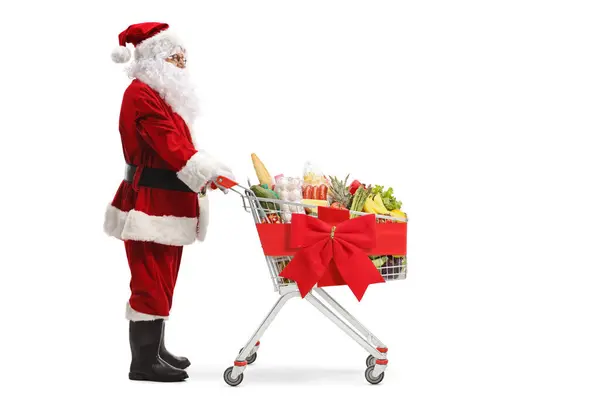 Ganztägige Profilaufnahme Des Weihnachtsmannes Der Mit Einem Einkaufswagen Steht Der — Stockfoto