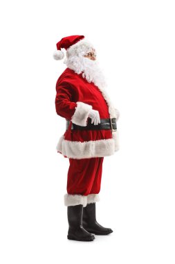Noel Baba 'nın beyaz arka planda izole edilmiş tam uzunluktaki profil çekimi