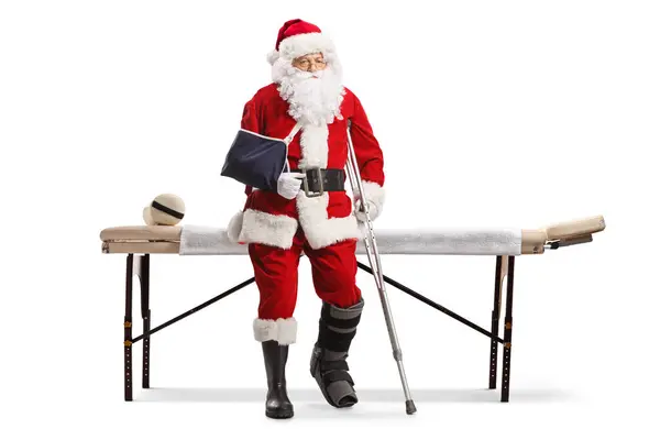 Sad Santa Claus Injured Leg Arm Sitting Mat Table Isolated — Stock Photo, Image