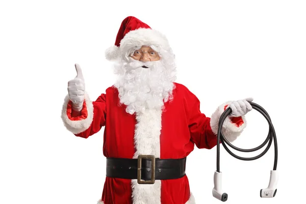 Santa Claus Κρατώντας Ηλεκτρικό Φορτιστή Του Οχήματος Και Gesturing Αντίχειρες — Φωτογραφία Αρχείου