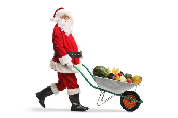 Santa Claus Walking Pushing Wheelbarrow Fruits Vegetables Isolated White Background — Stock Photo, Image